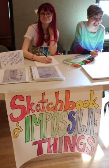 One of the stations where readers could win raffle tickets - Add a Page to The Sketchbook of Impossible Things. GREAT Additions!